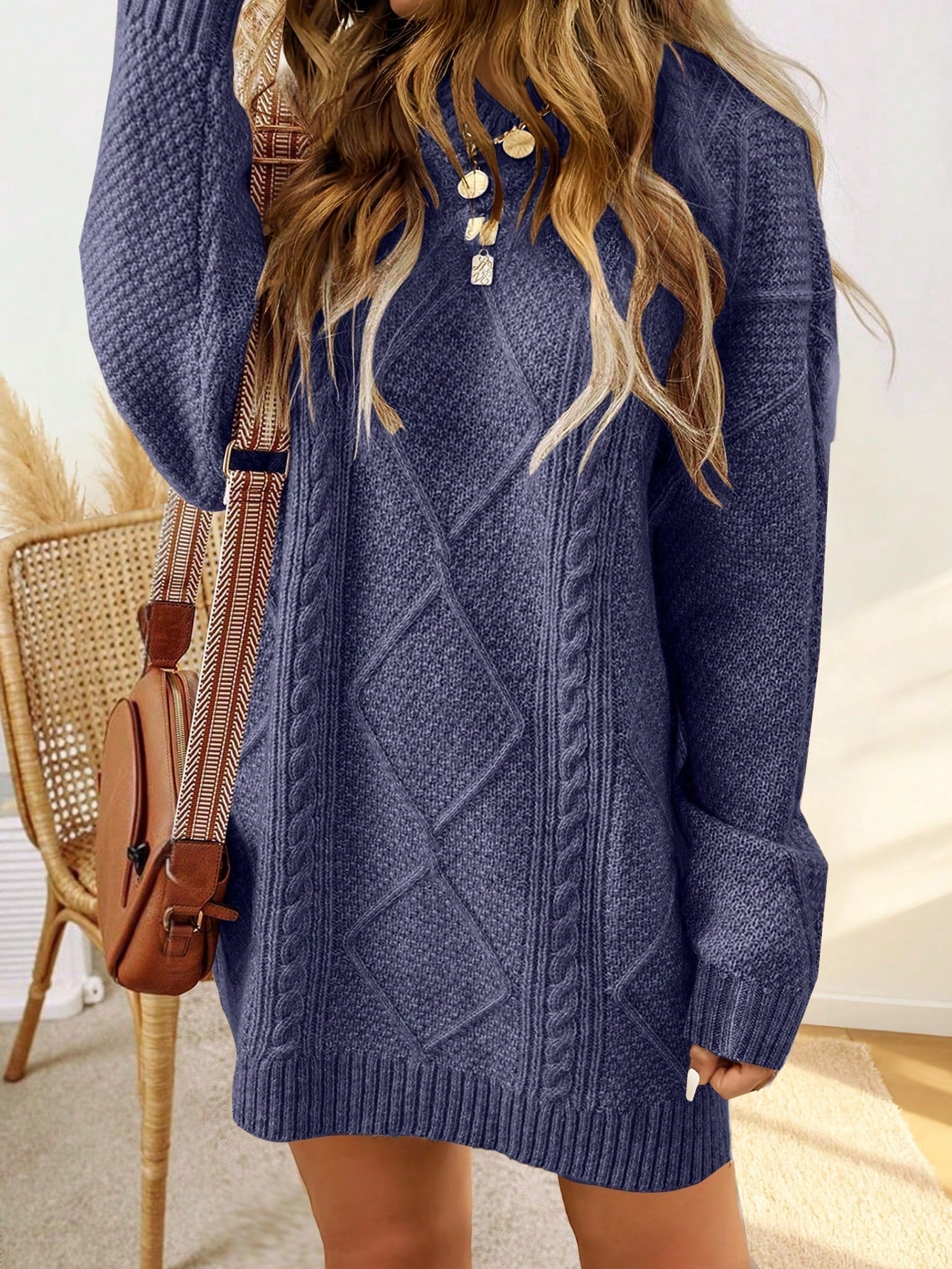 Trui jurk met kabelpatroon en ribbelafwerking