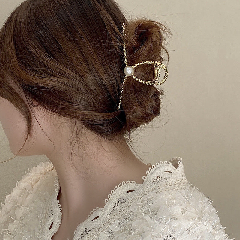 Dames Haarclip Parel en Gedraaid Metaal Sierrand