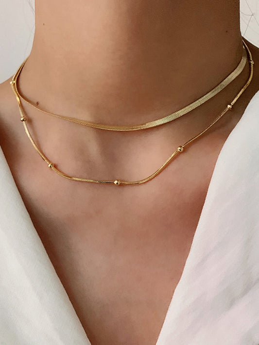 Goudkleurige Ketting met Gelaagde Kralen - StudioMarella