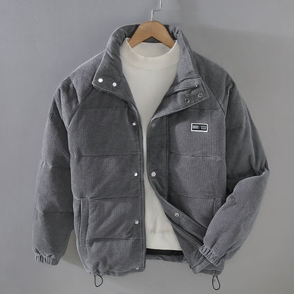 Grijze Brixen vintage winterjas van ribstof, met gewatteerde voering, opstaande kraag, knoop- en ritssluiting. Stijlvolle en warme jas voor een klassieke winterlook.