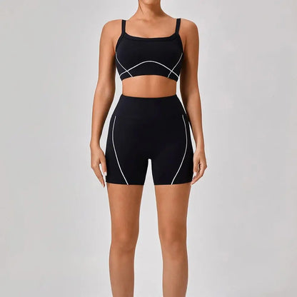 Vrouwelijke Sportieve Broek en Top Set