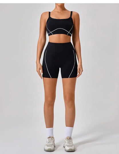Vrouwelijke Sportieve Broek en Top Set