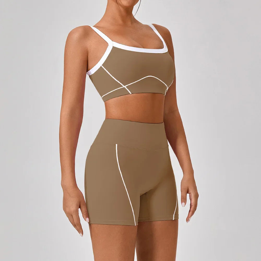 Vrouwelijke Sportieve Broek en Top Set