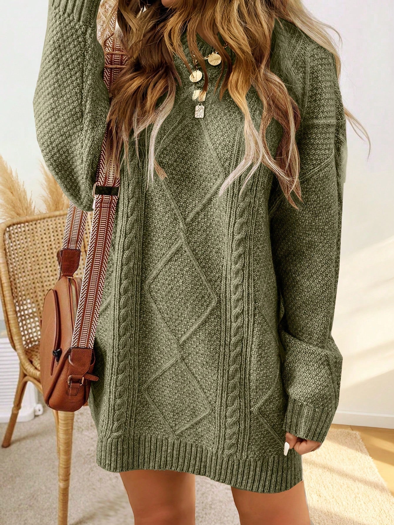 Trui jurk met kabelpatroon en ribbelafwerking