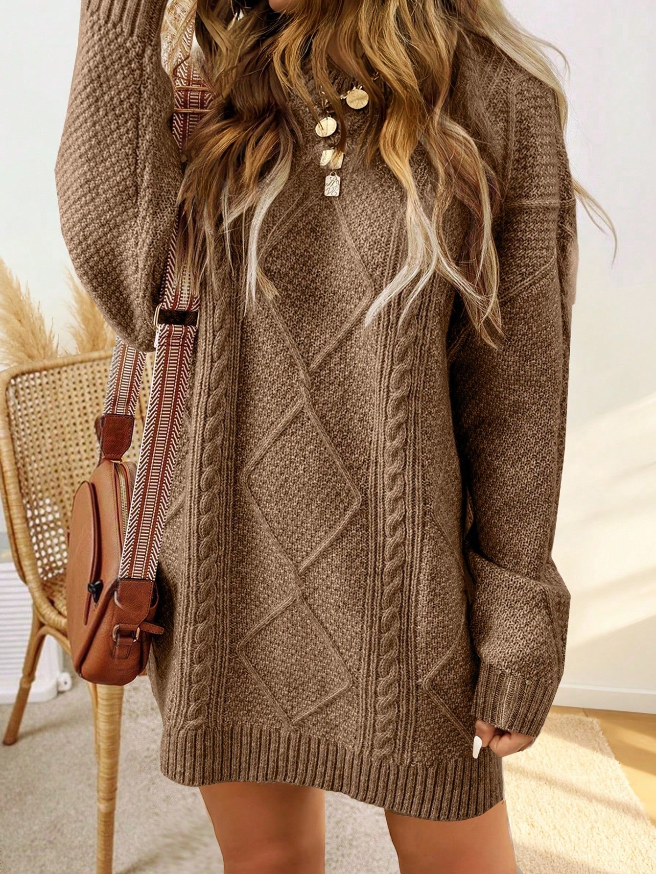 Trui jurk met kabelpatroon en ribbelafwerking