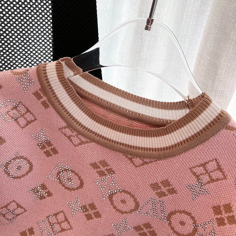 Gebreide Top met Gouden Detail en Ruches