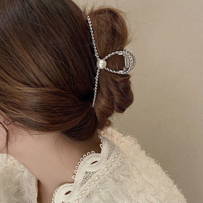 Dames Haarclip Parel en Gedraaid Metaal Sierrand