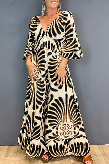Gebloemde Jumpsuit in de kleur Goud voor dames in stijl ideaal voor de lente.