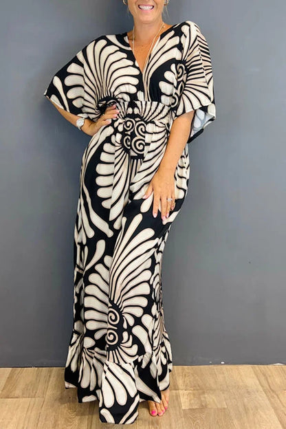 Gebloemde Jumpsuit in de kleur Zwart voor dames in stijl ideaal voor de lente.