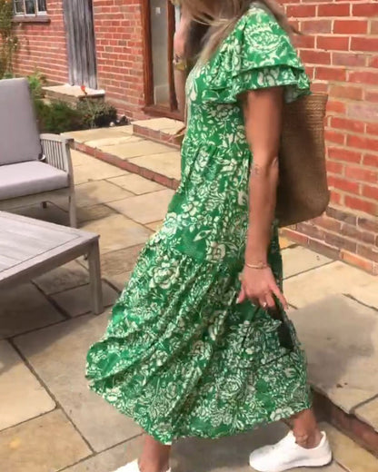 Lange jurk met korte mouwen en een bloemenprint in de kleur Groen voor dames in stijl ideaal voor de herfst.