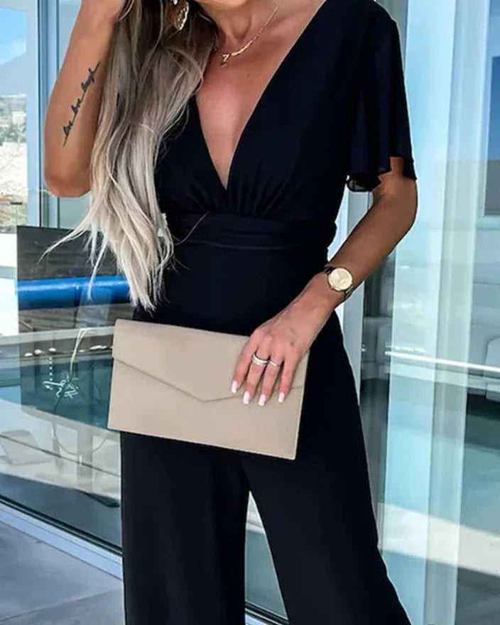 Jumpsuit met prachtige ruchemouwen en wijde pijpen voor een trendy en veelzijdige uitstraling. Gemaakt van hoogwaardig materiaal met een flatterende pasvorm.